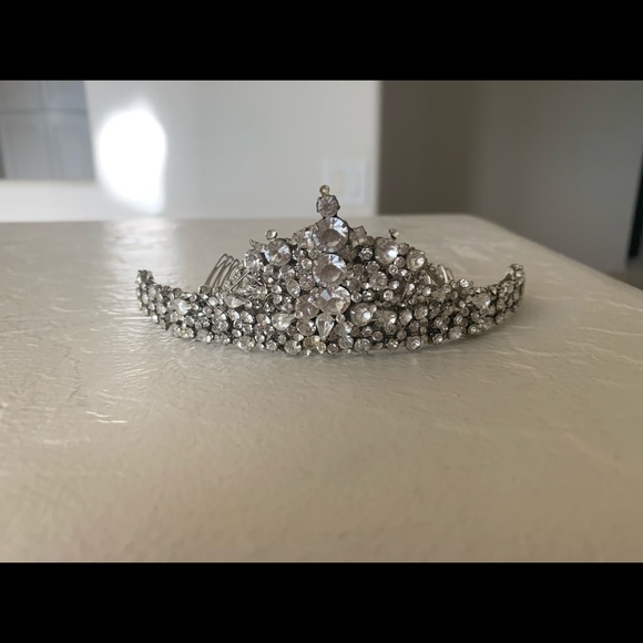 Wedding headpiece filled with Swarovski crystals .